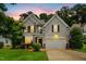 Charming two-story home with a well-manicured front lawn and inviting curb appeal at 304 Forbes Rd, Wake Forest, NC 27587