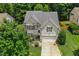 Charming two-story home featuring a two-car garage, landscaped front yard, and welcoming front porch at 304 Forbes Rd, Wake Forest, NC 27587