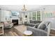 Comfortable living room with a fireplace, large windows, and plenty of natural light at 304 Forbes Rd, Wake Forest, NC 27587
