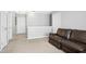 Neutral-toned living room with a plush sofa and an open, airy feel at 304 Forbes Rd, Wake Forest, NC 27587