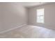 Bright carpeted bedroom with large window allowing natural light at 3045 Creek Moss Ave, Wake Forest, NC 27587