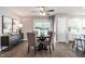 Cozy dining room with luxury vinyl floors, a modern light fixture and stylish furniture at 3045 Creek Moss Ave, Wake Forest, NC 27587