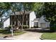 Traditional two-story home featuring a brick facade and detached garage at 3045 Creek Moss Ave, Wake Forest, NC 27587