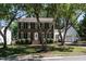Charming brick two-story home with mature trees and well-manicured lawn at 3045 Creek Moss Ave, Wake Forest, NC 27587