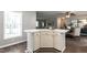 Kitchen island featuring white cabinets, white countertops, and luxury vinyl floors at 3045 Creek Moss Ave, Wake Forest, NC 27587