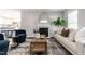 Bright living room featuring a fireplace, stylish decor, and hardwood floors at 3045 Creek Moss Ave, Wake Forest, NC 27587