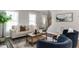 Bright living room with modern decor, hardwood floors, and ample natural light at 3045 Creek Moss Ave, Wake Forest, NC 27587