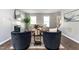Inviting living room with modern decor, hardwood floors, and ample natural light at 3045 Creek Moss Ave, Wake Forest, NC 27587