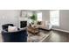 Cozy living room with fireplace, neutral decor, and hardwood floors at 3045 Creek Moss Ave, Wake Forest, NC 27587
