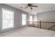 Bright and airy loft space with fresh paint, multiple windows, ceiling fan, and soft carpeting at 3045 Creek Moss Ave, Wake Forest, NC 27587