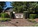 Community entrance with a brick sign reading, 'Moss Creek', surrounded by decorative landscaping and mature trees at 3045 Creek Moss Ave, Wake Forest, NC 27587