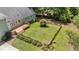 Aerial view of fenced backyard with wooden deck and lush landscaping providing a private outdoor space at 3113 Golden Nugget Dr, Clayton, NC 27520