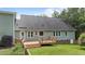 Beautiful backyard featuring a wooden deck, lush green lawn, and well-maintained landscaping at 3113 Golden Nugget Dr, Clayton, NC 27520