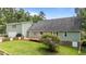 Backyard with a wooden deck perfect for entertaining, surrounded by lush greenery and well-kept lawn at 3113 Golden Nugget Dr, Clayton, NC 27520