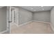 Finished basement with neutral walls and carpeting is ready for a new owner at 3113 Golden Nugget Dr, Clayton, NC 27520