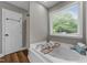 Elegant bathroom showcasing a large tub and natural light from a window at 3113 Golden Nugget Dr, Clayton, NC 27520