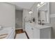 Well-lit bathroom with double vanity, marble countertop, and soaking tub at 3113 Golden Nugget Dr, Clayton, NC 27520