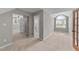 Bedroom featuring an arched window, neutral walls, and easy access to the bathroom at 3113 Golden Nugget Dr, Clayton, NC 27520