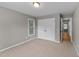 Bedroom featuring a double door closet and large window overlooking the backyard at 3113 Golden Nugget Dr, Clayton, NC 27520