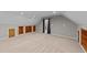 Large bonus room with carpet flooring and built-in bookcases at 3113 Golden Nugget Dr, Clayton, NC 27520