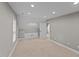 This bonus room features attic access doors, neutral paint and carpeting at 3113 Golden Nugget Dr, Clayton, NC 27520