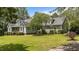 Beautiful home featuring manicured landscaping, a well-maintained lawn, and mature trees at 3113 Golden Nugget Dr, Clayton, NC 27520