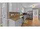 Bright kitchen featuring stainless steel appliances and tile backsplash at 3113 Golden Nugget Dr, Clayton, NC 27520