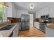 Kitchen view featuring stainless steel refrigerator and hardwood floors at 3113 Golden Nugget Dr, Clayton, NC 27520