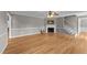 Spacious living room featuring hardwood floors, a fireplace, and classic ceiling fan at 3113 Golden Nugget Dr, Clayton, NC 27520