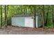 Backyard shed nestled among the trees is perfect for extra storage or hobby space at 3113 Golden Nugget Dr, Clayton, NC 27520