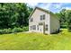 Spacious backyard with green grass and surrounded by mature trees at 3445 Dutchman Rd, Raleigh, NC 27610