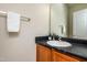 Bathroom vanity with sink, mirror, and towel bar at 3445 Dutchman Rd, Raleigh, NC 27610