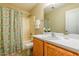 Well-lit bathroom featuring a tub-shower and a vanity with white countertop at 3445 Dutchman Rd, Raleigh, NC 27610