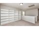 Upstairs bonus room with built-in shelving and a large window, perfect for storage and relaxation at 3445 Dutchman Rd, Raleigh, NC 27610