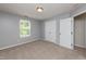 Neutral bedroom with large closet, a window for natural light, and plush carpet at 3445 Dutchman Rd, Raleigh, NC 27610