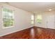 Bright living room with windows and a door to the exterior at 3445 Dutchman Rd, Raleigh, NC 27610