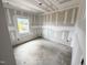 Bright bedroom with a large window, providing natural light, waiting for personalization and design at 360 Ambassador Dr, Clayton, NC 27520