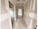 Spacious hallway with multiple doorways and a view to rooms with natural light, ready for customization at 360 Ambassador Dr, Clayton, NC 27520