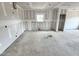 Spacious living area awaiting finishing touches, featuring a window and an open layout, ready for design at 360 Ambassador Dr, Clayton, NC 27520