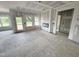 Bright living room featuring large windows, fireplace, and an open floor plan awaiting personalization at 360 Ambassador Dr, Clayton, NC 27520