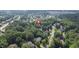 Aerial view of the neighborhood with a pin marking the property location, surrounded by lush greenery and trees at 3604 Thorndike Dr, Wake Forest, NC 27587