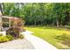 Lush backyard featuring a well-maintained lawn, patio, and mature trees providing shade and privacy at 3604 Thorndike Dr, Wake Forest, NC 27587