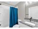 Bright bathroom showcasing a granite countertop, modern fixtures, and a shower-tub combo with subway tile at 3604 Thorndike Dr, Wake Forest, NC 27587