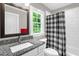 Bathroom features a vanity with granite countertops, a toilet, and a shower with a buffalo plaid curtain at 3604 Thorndike Dr, Wake Forest, NC 27587