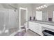 Bright bathroom featuring a glass shower, granite countertops, and white cabinets at 3604 Thorndike Dr, Wake Forest, NC 27587