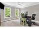 Bright bedroom with two large windows, neutral walls, and a ceiling fan at 3604 Thorndike Dr, Wake Forest, NC 27587