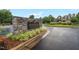 Stonegate Swim and Tennis Club entrance with stone signage and landscaped greenery, showcasing the community amenities at 3604 Thorndike Dr, Wake Forest, NC 27587