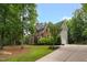 A luxurious home with a well-manicured lawn and a long driveway leading to an attached garage at 3604 Thorndike Dr, Wake Forest, NC 27587