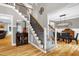 Grand foyer with hardwood floors, elegant staircase, and views into the dining room at 3604 Thorndike Dr, Wake Forest, NC 27587