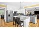 Beautiful kitchen with stainless steel appliances, granite countertops, and view of living area at 3604 Thorndike Dr, Wake Forest, NC 27587